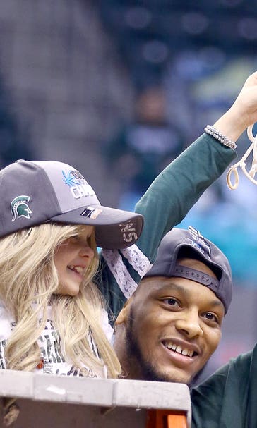 8-year-old battling cancer helps Spartans cut down nets
